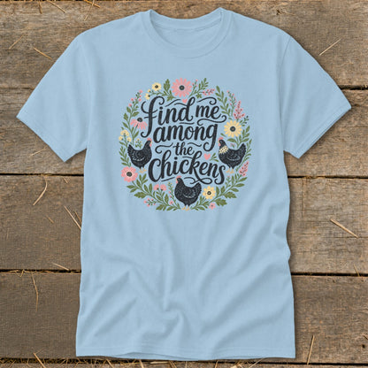 Light blue t-shirt with floral circle graphic reading "Find me among the chickens".