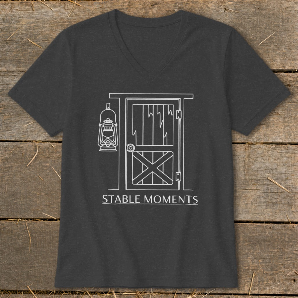 Dark grey t-shirt with white line art of barn door and lantern, reading "STABLE MOMENTS."