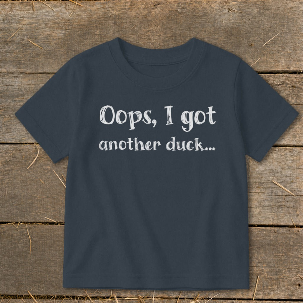 Navy t-shirt with white text that reads "Oops, I got another duck...".