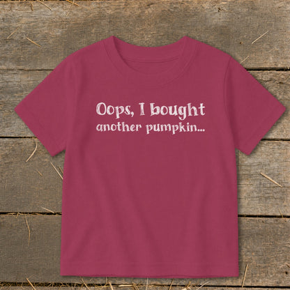 Pink t-shirt with white text "Oops, I bought another pumpkin..."