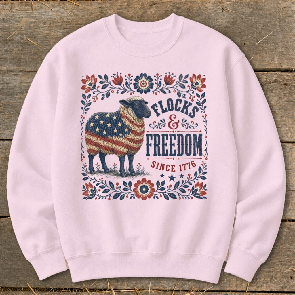 Light pink sweatshirt with a sheep patterned with the US flag and text.