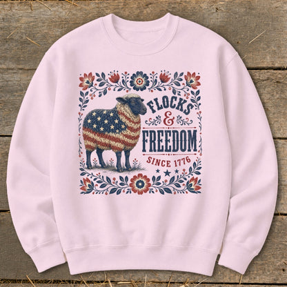 Light pink sweatshirt with a sheep patterned with the US flag and text.