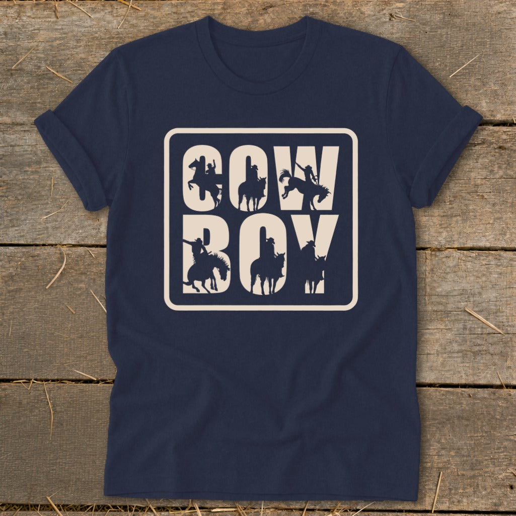 Navy t-shirt with "COW BOY" text and cowboy silhouettes in a rounded rectangle.