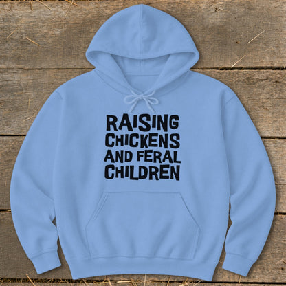 Light blue hooded sweatshirt with "RAISING CHICKENS AND FERAL CHILDREN" printed in black.