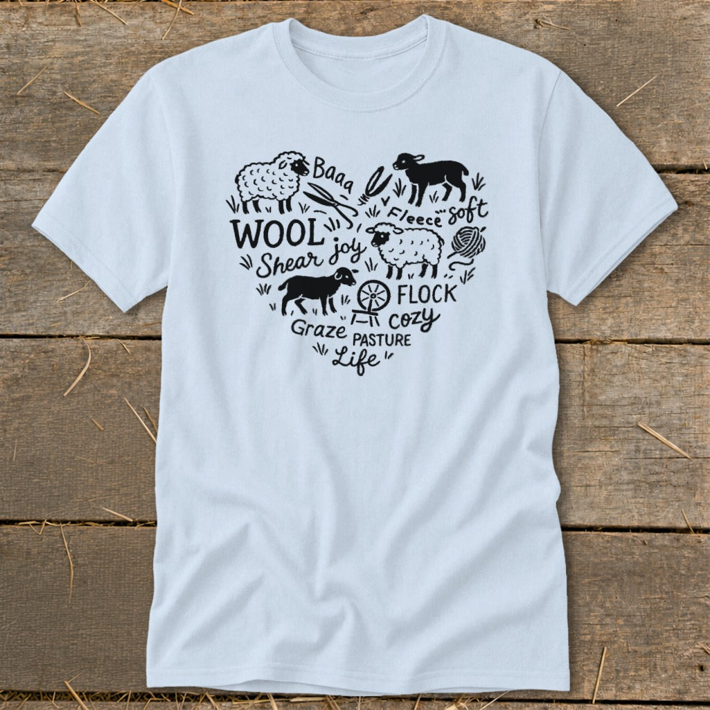 Light blue t-shirt with heart-shaped graphic of sheep and wool-related text.