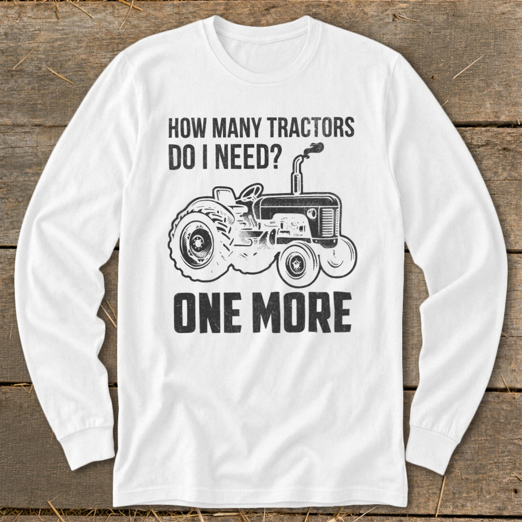 White long-sleeve shirt with "HOW MANY TRACTORS DO I NEED? ONE MORE" and tractor graphic.