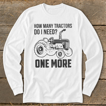 White long-sleeve shirt with "HOW MANY TRACTORS DO I NEED? ONE MORE" and tractor graphic.