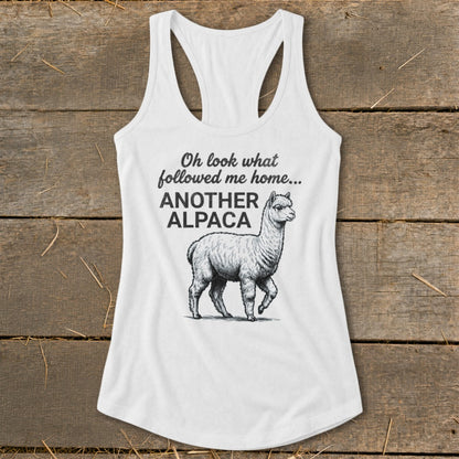 White tank top with alpaca graphic and text "Oh look what followed me home... ANOTHER ALPACA".