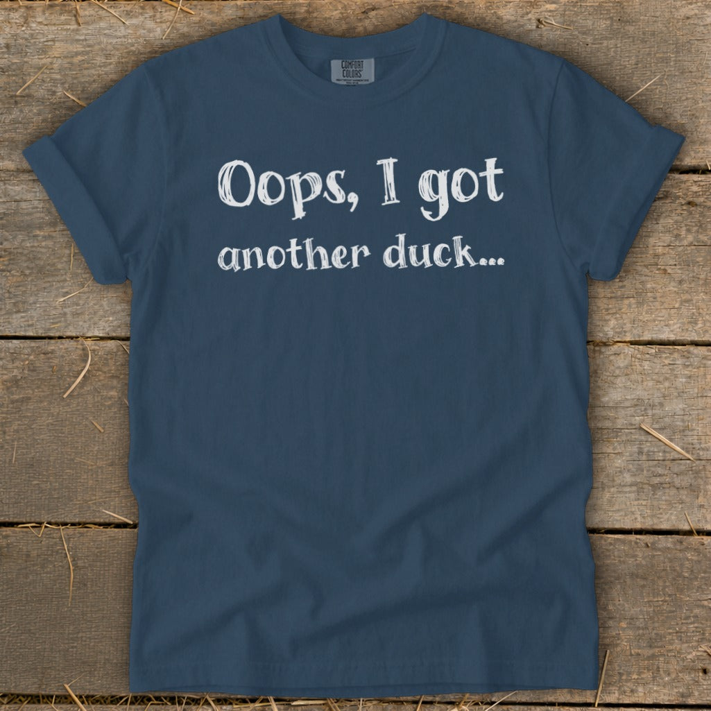 Blue t-shirt with white text "Oops, I got another duck..."