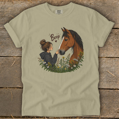 Illustration of girl booping horse with flowers and "Boop" text.
