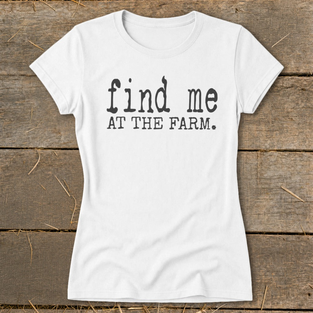 White t-shirt with black text reading "find me AT THE FARM."
