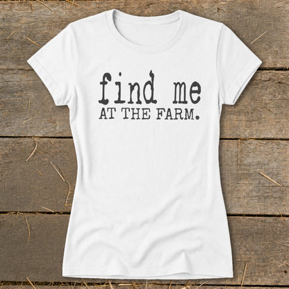 White t-shirt with black text reading "find me AT THE FARM."