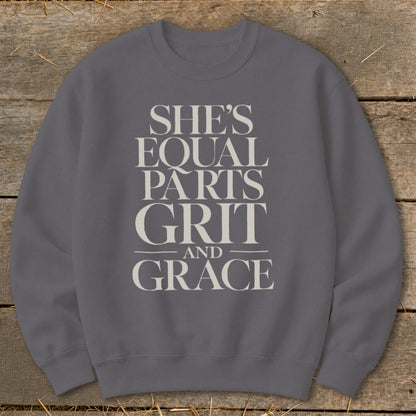Gray sweatshirt with "She's Equal Parts Grit and Grace" text design.