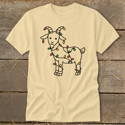 Light yellow t-shirt with a black line drawing of a goat wrapped in colorful Christmas lights.