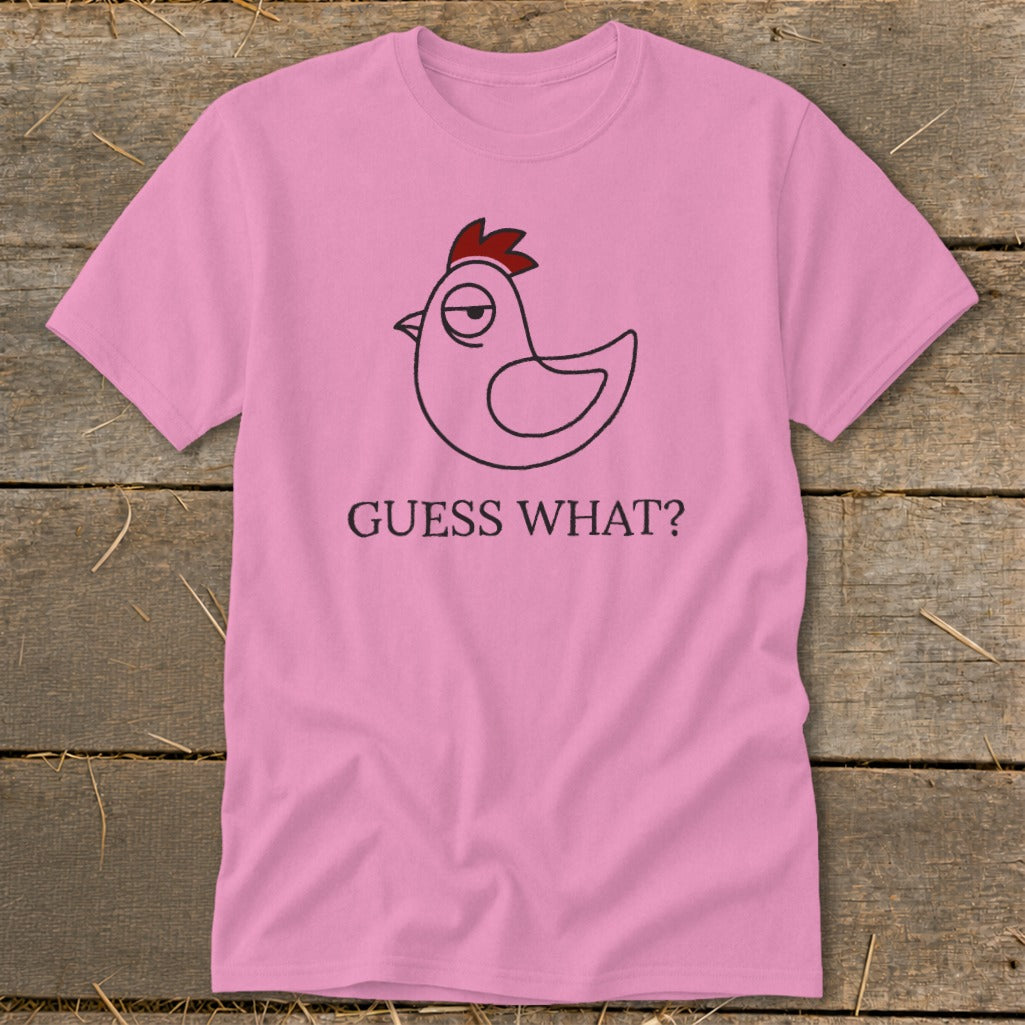 Pink t-shirt with a cartoon chicken and the text "GUESS WHAT?".
