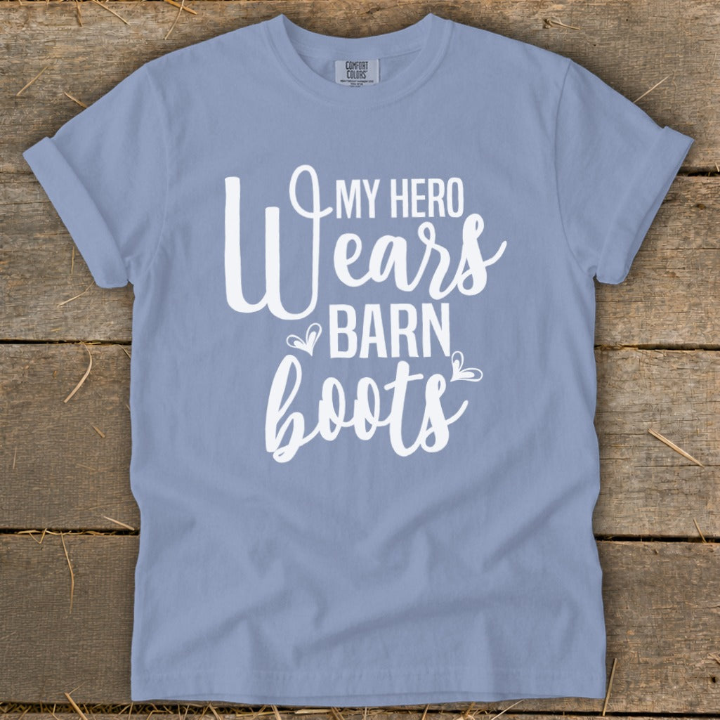 Light blue t-shirt with white text: "MY HERO Wears BARN boots".