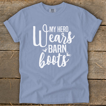 Light blue t-shirt with white text: "MY HERO Wears BARN boots".