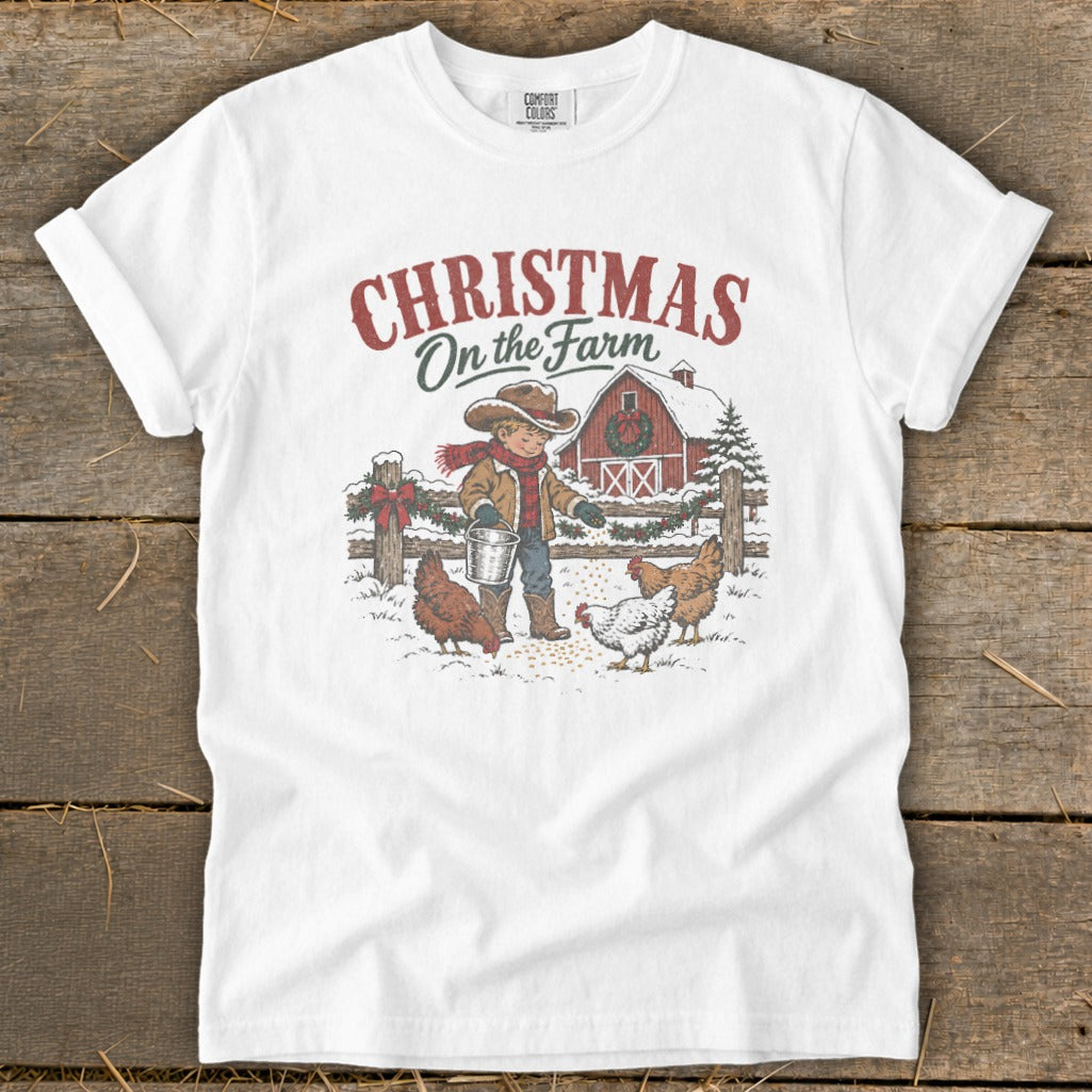 Christmas on the Farm graphic with boy feeding chickens and barn.