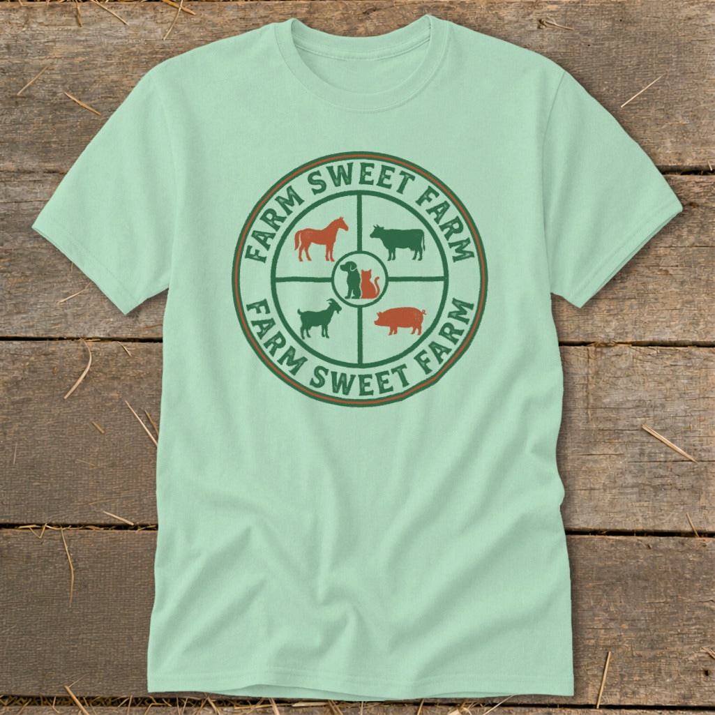 Pale green t-shirt with a circular farm animal graphic and "Farm Sweet Farm" text.