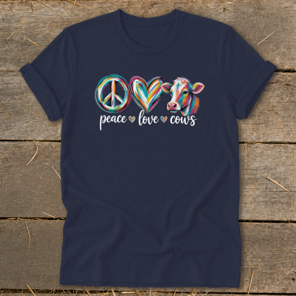 Navy t-shirt with peace sign, heart, and colorful cow graphic saying "peace love cows."