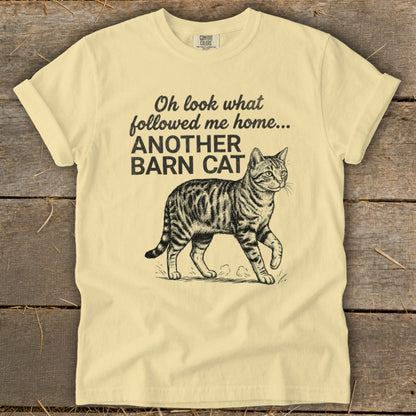 Light yellow t-shirt with "Oh look what followed me home... ANOTHER BARN CAT" text and a barn cat illustration.