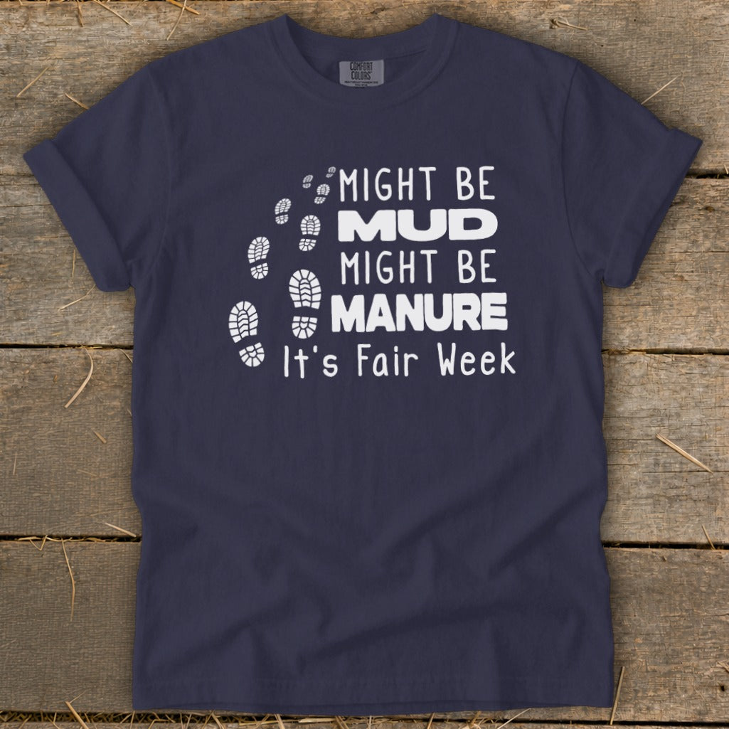 Navy t-shirt with white text: "Might be Mud, Might be Manure. It's Fair Week" and footprints.