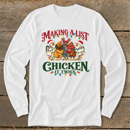 White long-sleeve shirt with chickens wearing Santa hats and Christmas lights, reading "Making a list, chicken it twice."