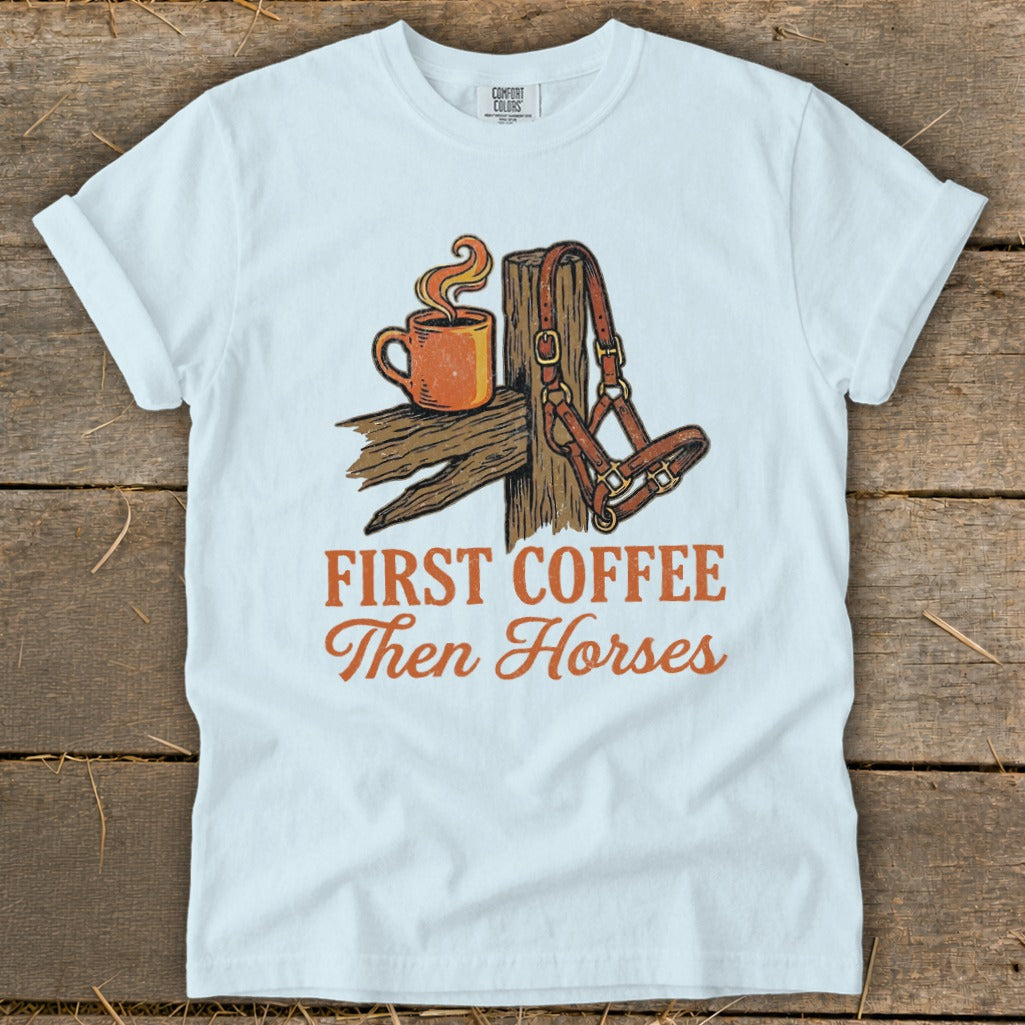 White t-shirt with "First Coffee Then Horses" text and horse halter image.
