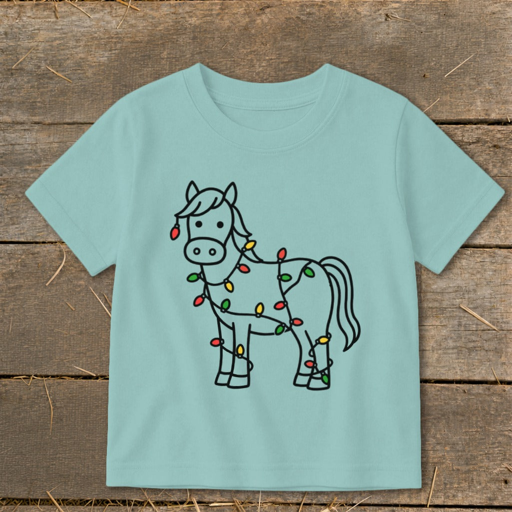Light blue t-shirt with a black outline drawing of a horse wrapped in Christmas lights.
