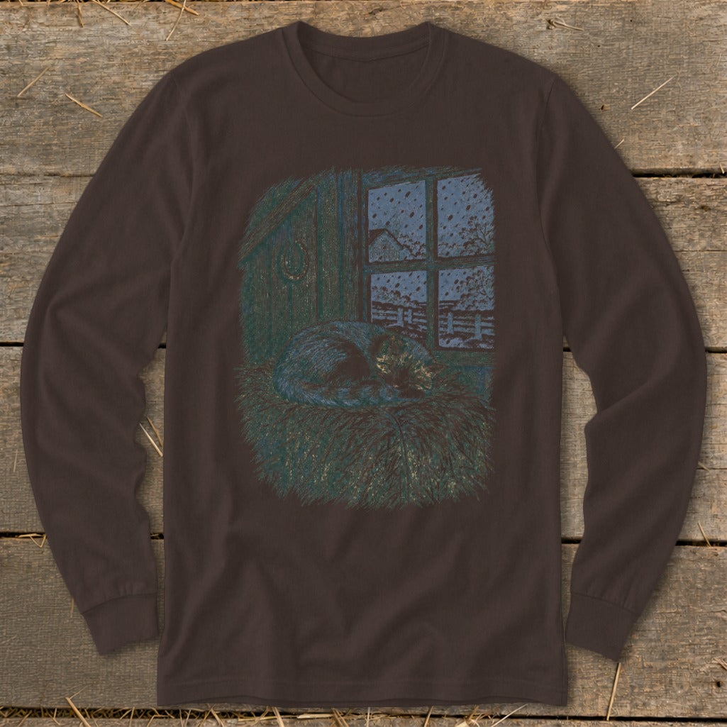 Brown long-sleeve shirt with graphic of cat sleeping on hay near a snowy window.