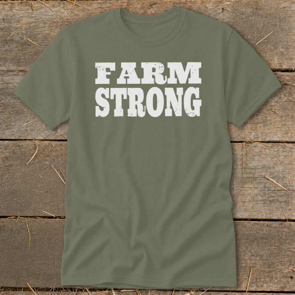 An olive green t-shirt featuring the white distressed text FARM STRONG centered on the chest.