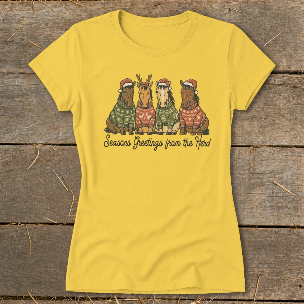 Yellow t-shirt with four horses in Christmas sweaters and Santa hats.