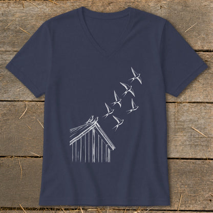A navy blue V-neck t-shirt with a white graphic of birds flying from a small wooden shed.