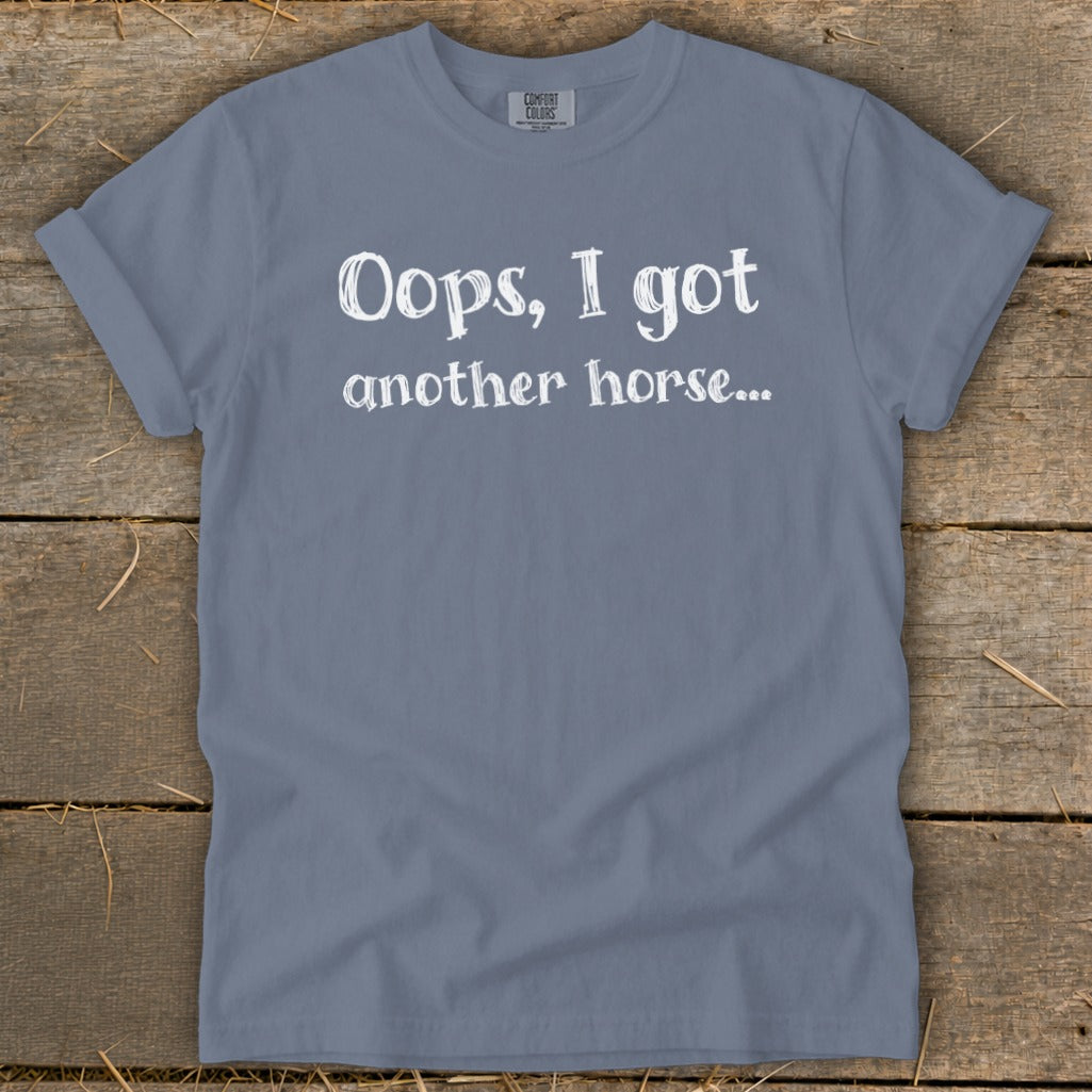 Grey t-shirt with white text "Oops, I got another horse...".