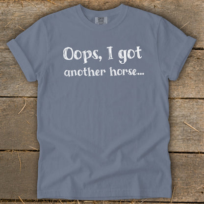 Grey t-shirt with white text "Oops, I got another horse...".