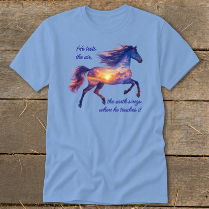 Light blue t-shirt featuring a galloping horse graphic filled with a sunset cloudscape and inspirational text.