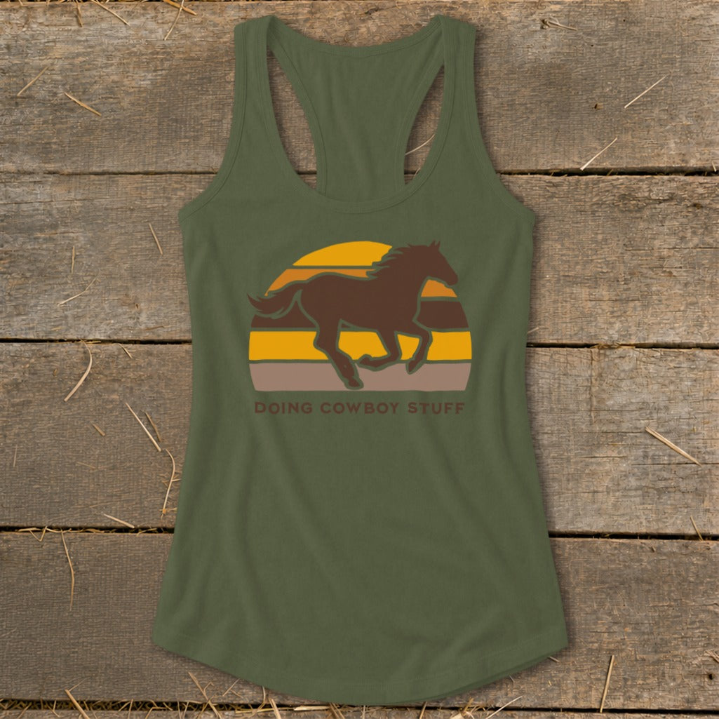 Green tank top with a brown horse graphic and "DOING COWBOY STUFF" text.