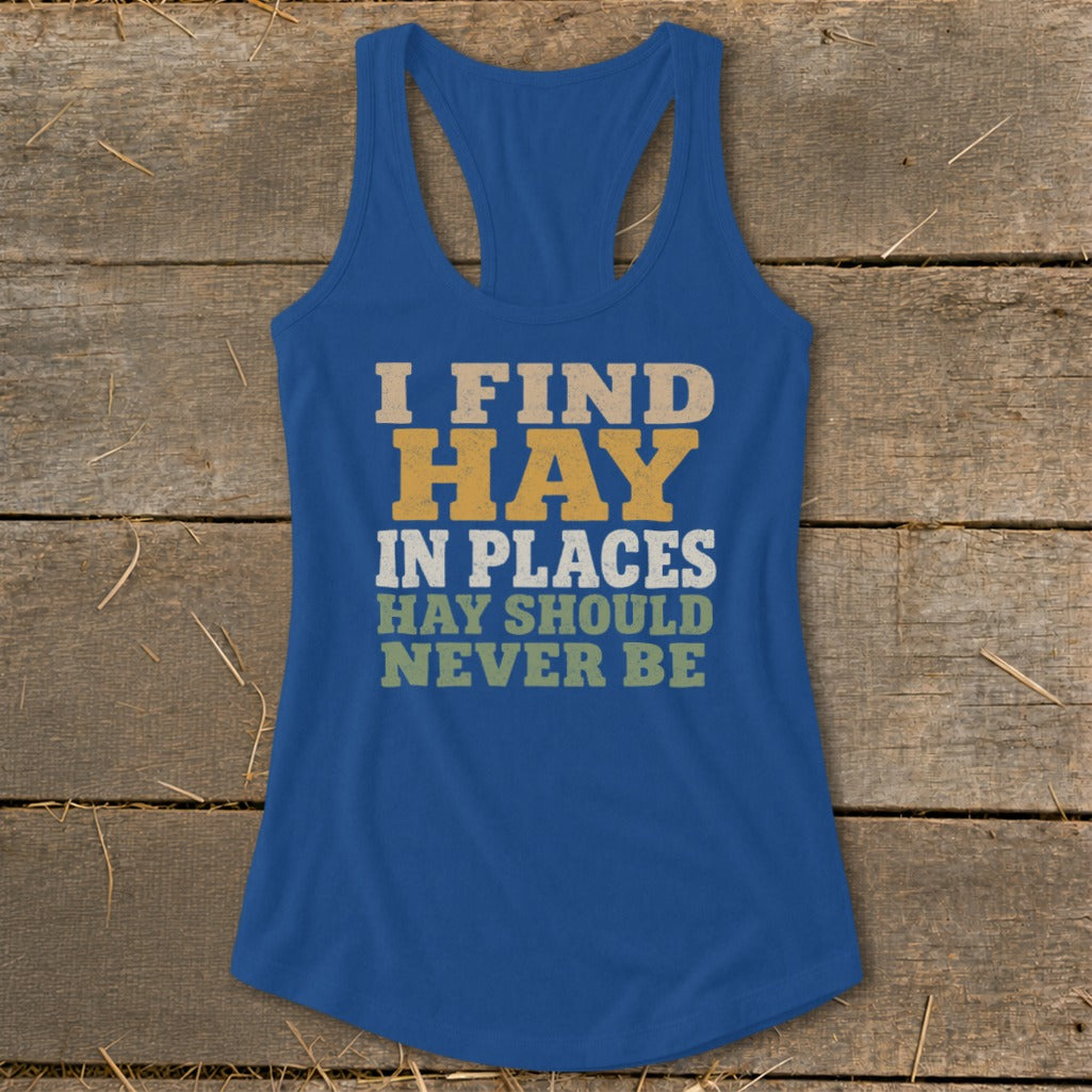 Blue tank top with "I FIND HAY IN PLACES HAY SHOULD NEVER BE" text.