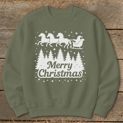 Green crewneck sweatshirt with white Christmas trees and Santa's sleigh pulled by horses.