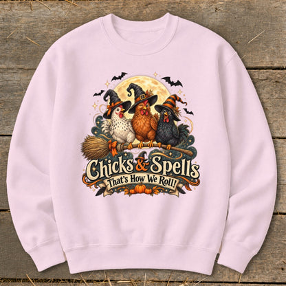 Three witch-hatted chickens ride a broomstick with "Chicks & Spells" text.