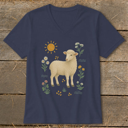 Navy v-neck t-shirt with a cream-colored sheep illustration surrounded by flowers and a sun.