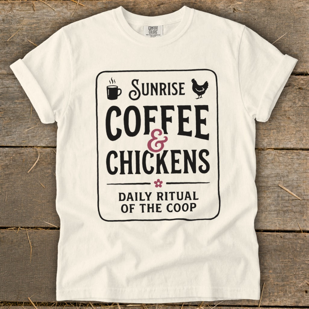 White t-shirt with black text: "Sunrise Coffee & Chickens Daily Ritual of the Coop".