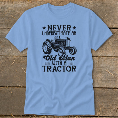 Light blue t-shirt with "Never Underestimate An Old Man With A Tractor" text and tractor graphic.