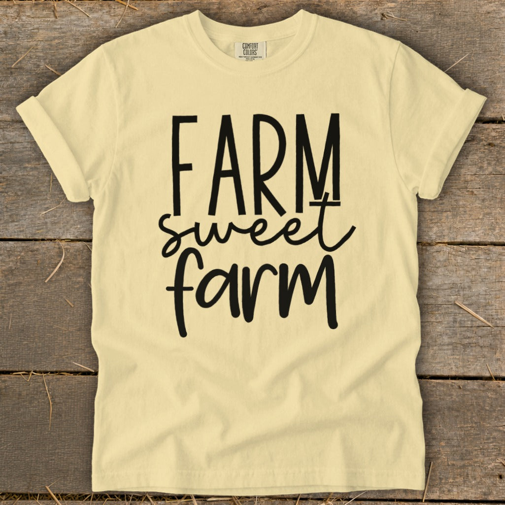 Yellow t-shirt with black text "FARM sweet farm" and "COMFORT COLORS" label.