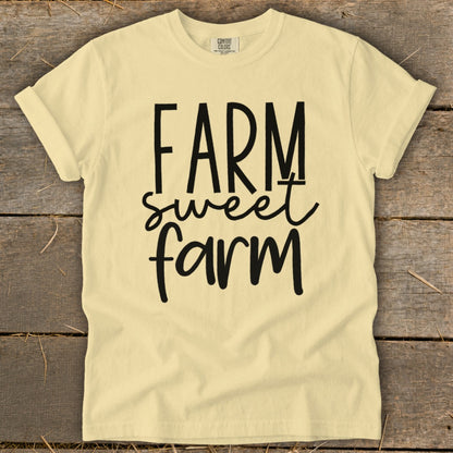 Yellow t-shirt with black text "FARM sweet farm" and "COMFORT COLORS" label.