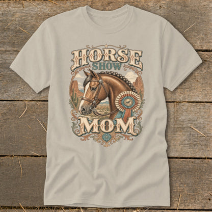 Horse Show Mom graphic on a light brown t-shirt with a horse, award ribbon, and desert background.