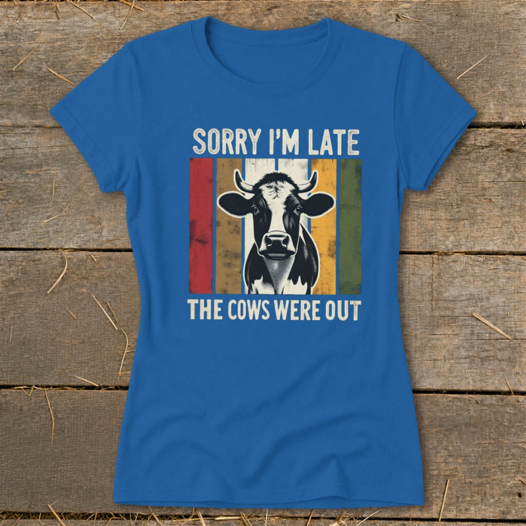 Blue t-shirt with a cow graphic and text "Sorry I'm Late, The Cows Were Out".