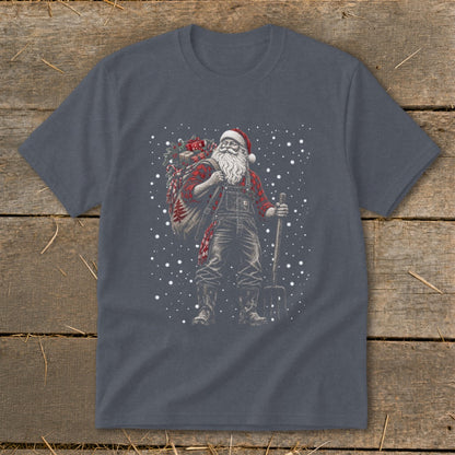 Santa Claus wearing overalls and a plaid shirt, carrying a sack and a pitchfork.