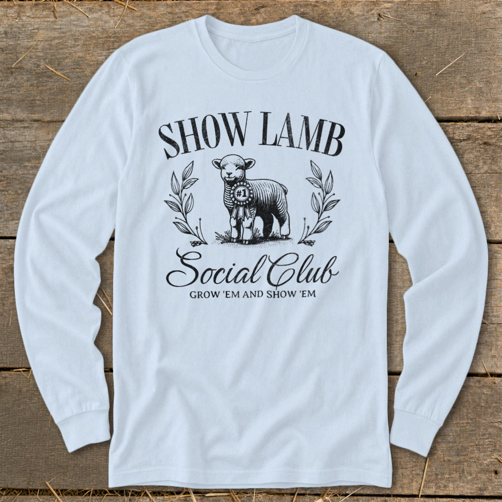 White long-sleeve shirt with "Show Lamb Social Club" graphic and a sheep.