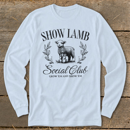 White long-sleeve shirt with "Show Lamb Social Club" graphic and a sheep.